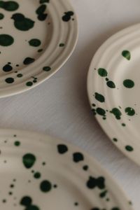 Kaboompics - Green Splatter Dinnerware Details in a Minimal Table Setting