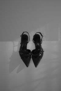Kaboompics - Black and White Slingback Heels with Wall Shadows