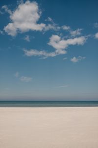 Kaboompics - Cloudy Sky Over an Empty Beach and Calm Sea