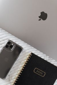 Kaboompics - Close Crop of MacBook, Smartphone and 2020 Planner on White Ribbed Marble