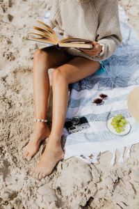 Kaboompics - Relaxed Beach Vacation with a Book and Straw Hat