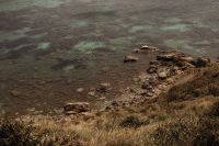Kaboompics - Clear Shallow Seawater Along a Grassy Rocky Shore