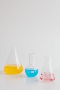 Kaboompics - Minimal Colorful Flasks Against a Bright Background