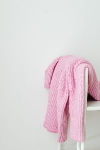 Kaboompics - Pink Knit Sweater on a White Chair