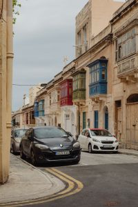 Kaboompics - Cars on a Curving Malta Street