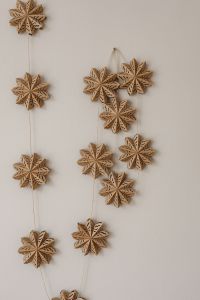 Kaboompics - Vertical Garland of Wooden Christmas Snowflakes