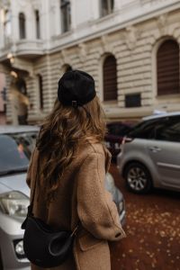 Kaboompics - Rear View of Woman in Camel Coat and Black Cap on City Street