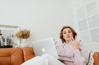 Kaboompics - Middle-Aged Woman Speaking During a Video Call While Working from Home