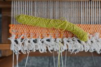 Kaboompics - Loose White Yarn Across Blue Woven Textile