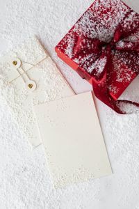 Kaboompics - Minimal Red Gift Box, Blank Greeting Card and Gold-Tied Gift Tags on White