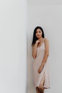 Kaboompics - Asian Woman in Pale Slip Dress Posing in a White Corner