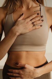 Kaboompics - Close-Up of Woman Holding Her Hands Over Chest and Waist