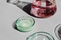Kaboompics - Pink Laboratory Flask and Glass Petri Dish Flat Lay