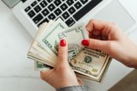 Kaboompics - Close Up of Hands Counting US Dollar Bills