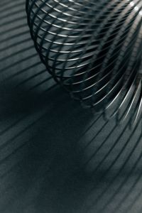 Kaboompics - Silver Metal Spring Coil with Diagonal Shadow