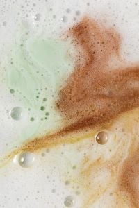 Kaboompics - Mint and Warm Brown Skincare Cream Swirls with Fine Bubbles, Abstract Macro