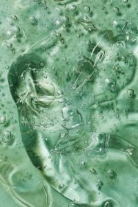 Kaboompics - Skincare Gel Texture Close-Up with Air Bubbles on Green Background