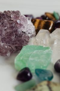 Kaboompics - Macro Photo of Purple Amethyst Crystals with Clear Quartz and Tiger's Eye in Soft Focus