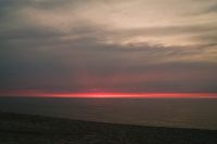 Kaboompics - Red Sunset Glow Along the Ocean Horizon