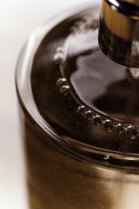 Kaboompics - Dark Liquid in Glass Bottle with Bubbles