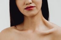 Kaboompics - Asian Woman Beauty Portrait with Red Lips, Bare Shoulders and Neutral Background