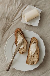 Kaboompics - Sliced Bread With Butter and a Vintage Knife