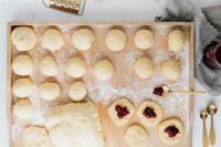 Kaboompics - Tray of Pączki Dough Rounds with Cherry Filling