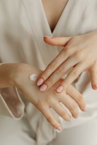 Kaboompics - Rubbing Moisturizing Cream into the Back of a Hand