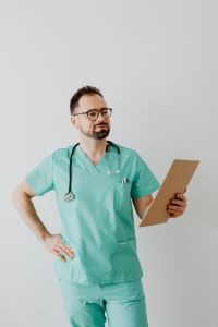 Kaboompics - Doctor Holding Clipboard With One Hand