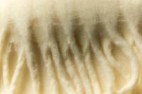 Kaboompics - Cream Wool Scarf Fringe Texture for Winter Background