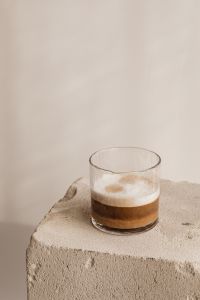 Kaboompics - Neutral Espresso Glass on Concrete with Soft Copy Space