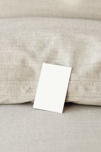 Kaboompics - Close-Up Vertical Blank Business Card on Textured Linen
