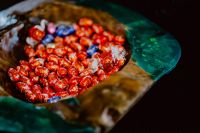 Kaboompics - Red and Blue Foil-Wrapped Chocolate Easter Eggs in a Wooden Bowl, Easter Candy Background