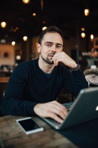 Kaboompics - Young Entrepreneur Working from a Modern Cafe