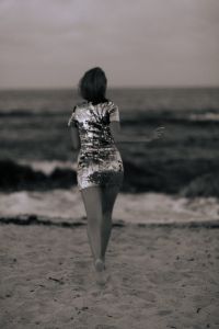 Kaboompics - Black and White Woman Walking on the Beach