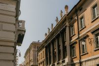 Kaboompics - Yellow Palazzo Windows with Shutters and Decorative Stonework