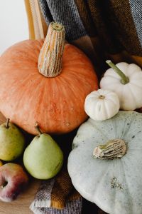 Kaboompics - Close-Up of an Orange Pumpkin, Mini White Pumpkins and Striped Squash, Autumn Still Life