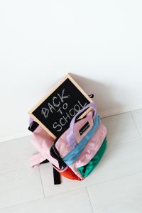 Kaboompics - Colorful School Backpacks with Back to School Chalkboard