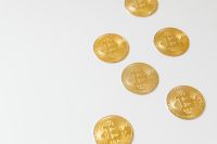 Kaboompics - Gold Bitcoin Coins on White Background