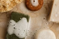 Kaboompics - Foamy Natural Soap Bars and Sea Sponges on Stone