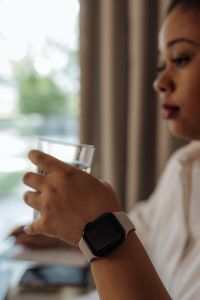 Kaboompics - Black Woman Drinking Water Near Window