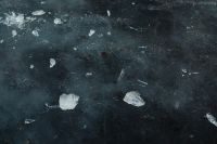 Kaboompics - Ice Chunks Scattered Across Dark Frozen Water