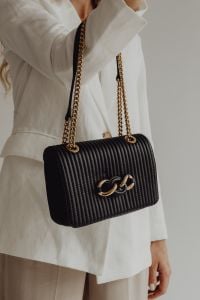 Kaboompics - Black Ribbed Shoulder Bag with Gold Chain and Sculptural Clasp