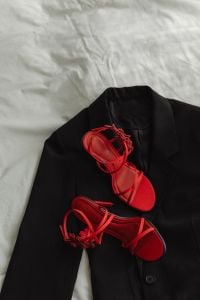 Kaboompics - Black Blazer with Red Strappy Heels on White Bedding