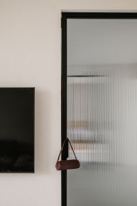 Kaboompics - Burgundy Woven Shoulder Bag by Glass Door