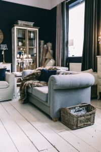 Kaboompics - Vintage Gray Armchair With Fur Throw In An Eclectic Living Room