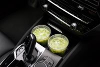 Kaboompics - Two Iced Matcha Lattes in Car Cup Holders Close Up