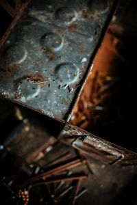 Kaboompics - Aged Blue Gray Metal Surface With Rust and Circular Marks