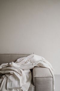 Kaboompics - Neutral Sofa with Draped White Linen – Fujifilm X100VI