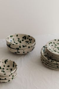 Kaboompics - Green Splatter Bowls and Plates in a Neutral Tableware Composition